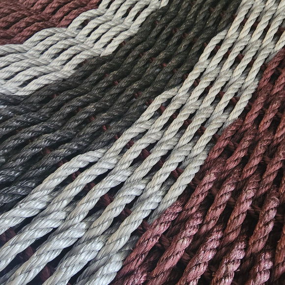 Close-up of braided ropes in various colors.