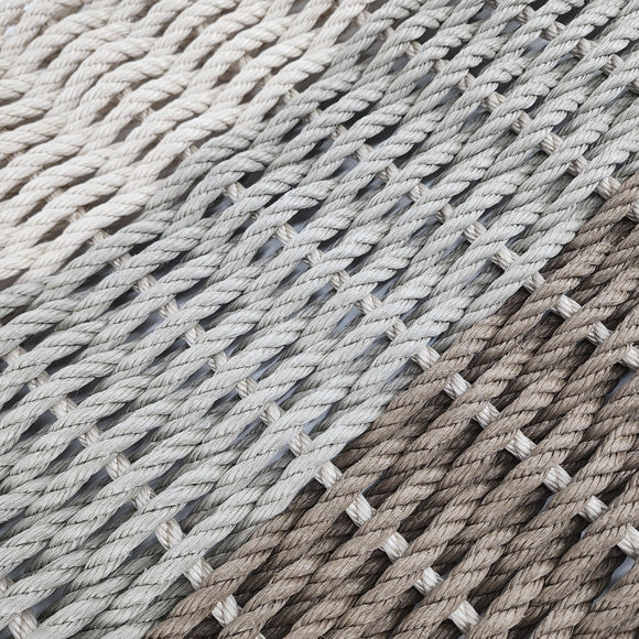 Close-up of woven rope mat with natural and gray tones