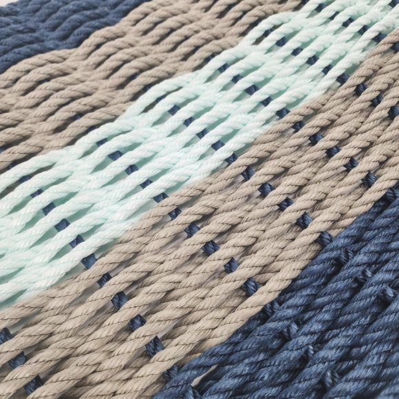 Close-up of braided ropes in various colors including blue, green, and brown.