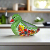 Decorative green duck with floral design on a kitchen counter
