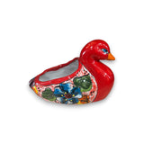 Red ceramic duck-shaped planter with floral design on a white background