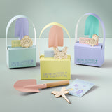 Set of gardening-themed gift boxes with tools and decorative items on a light gray background Pollinator Easter Gift Set (3pk)