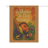 Decorative garden flag with cornucopia, pumpkins, and flowers on a brown background.