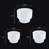 White ceramic cups with dimensions indicated on a black background 3-Piece White Plastic Planter Pot Set – Modern Pedestal Base