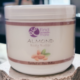 Jar of almond body butter with 'Lavender More' branding on a wooden surface.