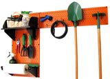 Orange pegboard wall with various tools and equipment on a white background