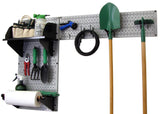 Wall-mounted garden tool organizer with various gardening tools on a white background