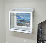 Wall-mounted Janco Garden Window with a view of a snowy landscape on a gray wall.