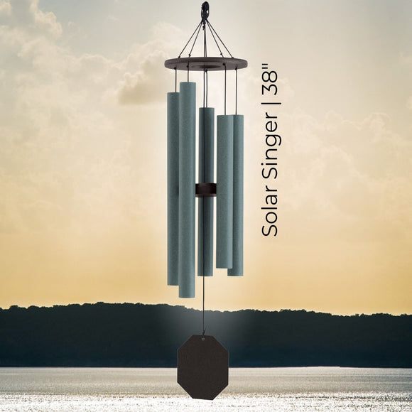 Ozark Echoes Series Wind Chime with 'Solar Singer 38' text against a sunset sky.