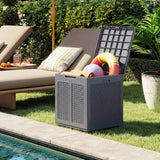 Gray storage box with pool accessories next to a lounge chair by a pool