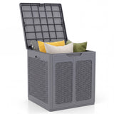 Gray storage box with a lid filled with colorful pillows on a white background
