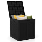 Black storage box with a lid filled with colorful pillows on a white background
