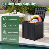 Black storage box with patio cushions, garden tools, sports equipment, and pool supplies on a patio.