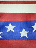 Close-up of a red, white, and blue striped fabric with white stars.