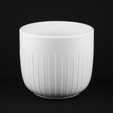 White Stoneware Planter Pot with Vertical Groove Texture with ribbed texture on a black background