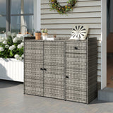 A rectangular outdoor storage cabinet with a gray and black woven wicker pattern, featuring three doors and a top surface with decorative items, set against a house exterior with siding and a planter box.