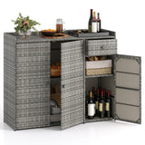 Gray wicker-style outdoor storage cabinet with two doors, one open to show shelves and wine bottles inside, topped with a planter and drinkware on a white studio background.
