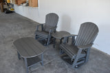Gray outdoor chairs and table set against a white wall. 4 pc Glider Adirondack Chair and Table Set