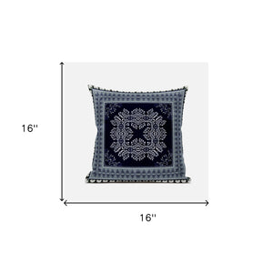 Decorative pillow with a central black and white pattern on a light gray background