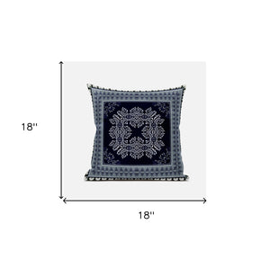 Decorative pillow with a central black and white pattern on a light gray background