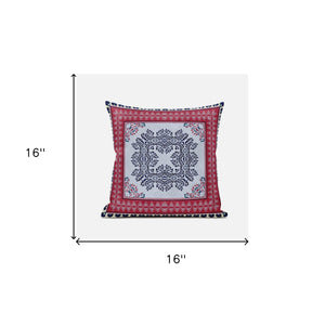 Decorative pillow with a red border and central pattern on a white background