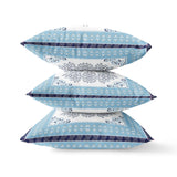 Three decorative pillows with blue and white pattern on a white background