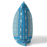 Decorative pillow with blue and white geometric pattern on a white background