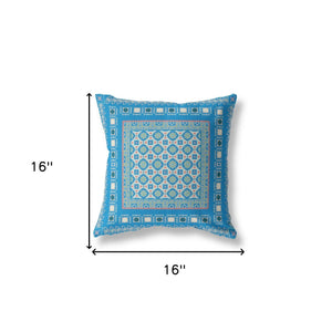 Decorative pillow with blue geometric pattern on a white background