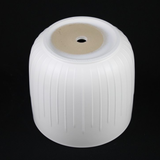 Bottom of a white cylindrical pot with ribbed texture on a black background