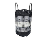 Black and white woven basket with handles on a white background