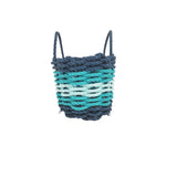 Woven basket with blue and green gradient on a white background