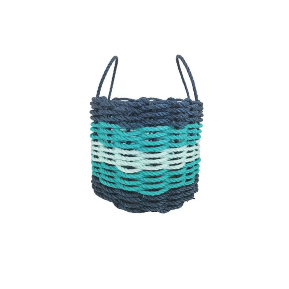 Woven basket with blue and green pattern on a white background