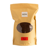 Neem Cake package with brown contents and Revival label on a white background