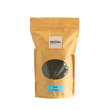 Yellow package of Basalt Rock Dust with 'Revival' branding on a white background