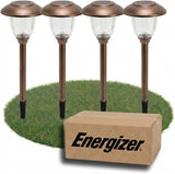 Four solar-powered garden lights with an Energizer box on a grass patch