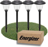Four solar-powered garden lights with an Energizer box on a grass patch