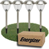 Four solar-powered garden lights on grass with an Energizer box in front.