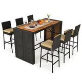 Seven-piece outdoor bar-height dining set featuring a rectangular wicker table with a wood-look top and six matching high-back chairs with beige cushions, shown on a white background.