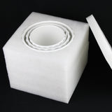 White foam block with a circular cutout on a black background 3-Piece White Stoneware Planter Set with Fluted Design