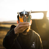 Person holding four different types of arrows with a blurred background
