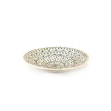 Decorative plate with intricate patterns on a white background