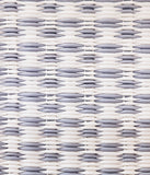 Close-up of a woven pattern with alternating white and gray strands.