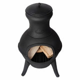 Black cast iron chiminea with wood inside on a white background