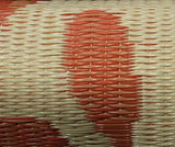Close-up of a woven Bellingrath Salmon mat with red and white pattern