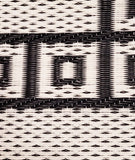 Close-up of a woven fabric with black and white geometric pattern