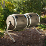 Two cylindrical compost bins on stands with a garden background