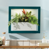 Framed  Smart Standard Growframe on a wall with a wooden console table below.
