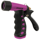 Black and pink garden hose spray nozzle with 'Dramm' branding on a white background