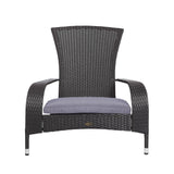 Wicker chair with a gray cushion on a white background