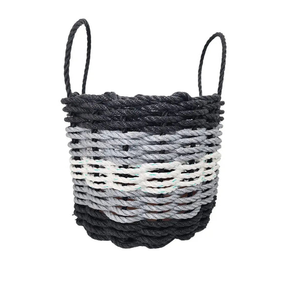 Woven basket with black and gray pattern on a white background